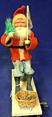 1930 Vintage Santa withTree on Moving Board withWind-up Mechanism & Christmas Flag