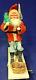 1930 Vintage Santa Withtree On Moving Board Withwind-up Mechanism & Christmas Flag