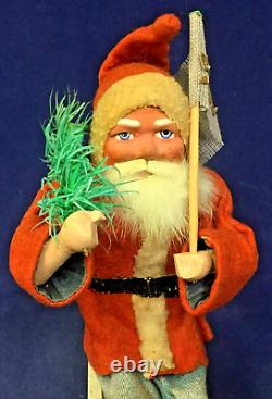 1930 Vintage Santa withTree on Moving Board withWind-up Mechanism & Christmas Flag