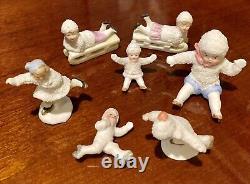 7 Antique German Bisque Porcelain Snow Babies Skaters, Sledders, Seated RARE