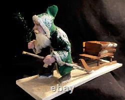 Antique German Christmas Green Coat Trudging Santa Claus pulling Sleigh