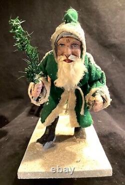 Antique German Christmas Green Coat Trudging Santa Claus pulling Sleigh