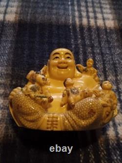 Carved resin Buddah with playing children figure. Finely crafted, signed. Rare