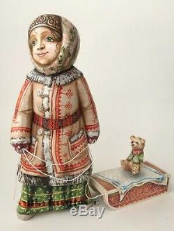 Collectible wooden Girl with a Teddy Bear sitting on a sled folk winter figurine