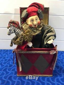 Mark Roberts red and gold, satin covered jack in the box jester with toy zebra