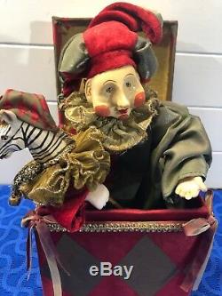 Mark Roberts red and gold, satin covered jack in the box jester with toy zebra