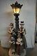 Old World Victorian Christmas Carolers By Lamp Post Statue