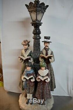 Old World Victorian Christmas Carolers By Lamp Post Statue