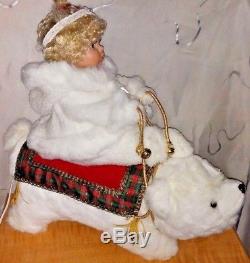 Santa's Best Christmas Animated Collectible snow baby girl doll riding the bear