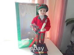 Telco Child Animated Xmas Motionette Doll Boy with Gifts & Candle Holiday Figure