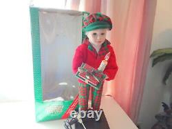 Telco Child Animated Xmas Motionette Doll Boy with Gifts & Candle Holiday Figure
