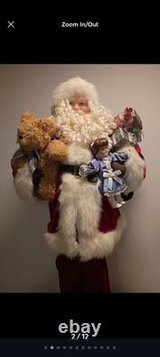 This is a life-sized decorative Santa Claus figure. The figure is shown