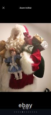 This is a life-sized decorative Santa Claus figure. The figure is shown
