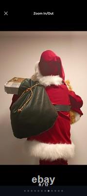This is a life-sized decorative Santa Claus figure. The figure is shown