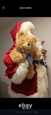 This is a life-sized decorative Santa Claus figure. The figure is shown
