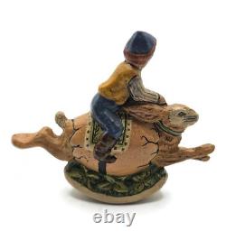 Vaillancourt Limited Edition Boy Riding Bunny in Egg Rocker Chalkware Figurine