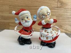 Vintage Japan Hula Hooping Santa and Mrs. Claus Salt And Pepper Shakers